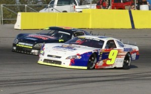 Chase Elliott battles with Russell Fleeman for position during last year's Larry Fleeman Memorial at Gresham Motorsports Park.  Elliott would go on to score the win.  Photo by Terry Spackman