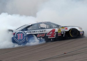 Kevin Harvick celebrates with a burnout after winning the NASCAR Sprint Cup Series race at Phoenix International Raceway last March.  It was the first of two wins for Harvick at the track in 2014.  Photo by Robert Laberge/Getty Images