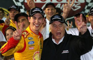 Joey Logano celebrates in victory lane with team owner Roger Penske after winning the NASCAR Sprint Cup Series race Saturday night at Richmond International Raceway. Photo by Todd Warshaw/NASCAR via Getty Images