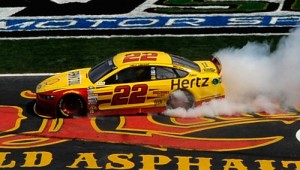 Joey Logano celebrates with a burnout after winning last year's NASCAR Sprint Cup Series spring race at Texas Motor Speedway. Photo by Jared C. Tilton/Getty Images