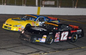 Austin McDaniel (12) passed Josh Berry (88) early in the running of the Late Model feature Saturday night at Hickory Motor Speedway, and went on to score his first victory of 2014.  Photo by Sherri Stearns