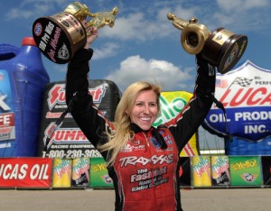 Courtney Force celebrates after winning the 100th NHRA win by a female with a win in Funny Car competition at Hartland Park Topeka Sunday afternoon.  Photo courtesy NHRA Media