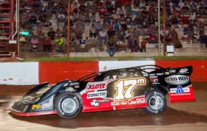 Dale McDowell flashes under the checkered flag to score the Super Late Model feature win in front of a packed house at Dixie Speedway Saturday night.  Photo by Kevin Prater/praterphoto.com