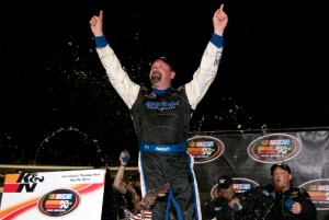 Greg Pursley celebrates his 19th NASCAR K&N Pro Series West career victory Saturday night at Kern County Raceway Park. Photo by Jason O. Watson/Getty Images for NASCAR