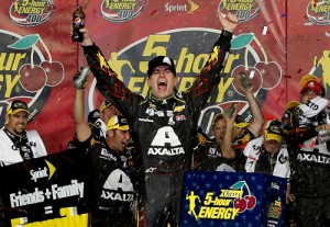 Jeff Gordon celebrates in victory lane after winning Saturday night's NASCAR Sprint Cup Series race at Kansas Speedway.  Photo by Jerry Markland/NASCAR via Getty Images