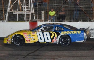 Josh Berry sweeps under the checkered flag to score his second straight and third overall Late Model victory at Hickory Motor Speedway Saturday night.  Photo by Sherri Stearns