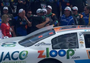 Justin Boston (center) is hugged by team members in victory lane after scoring his first ARCA Racing Series victory Sunday afternoon at Toledo Speedway.  Photo courtesy ARCA Media