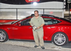 Kirk Pennywitt put an unusual car - a 2013 Tesla Model S - in victory lane last week at Atlanta Motor Speedway with a win in the Factory Street division in the Friday Night Drags season opener.   Photo by Tom Francisco/Speedpics.net