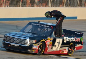 Kyle Busch bows to the crowd after winning the NASCAR Camping World Truck Series race at Dover International Speedway Friday.  Photo by Drew Hallowell/NASCAR via Getty Images