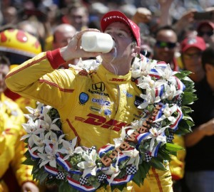 Ryan Hunter-Reay takes the traditional drink of milk in victory lane after winning Sunday's Indianapolis 500.  Hunter-Reay used a late race pass to score the victory over Helio Castroneves.  Photo by Shawn Gritzmacher