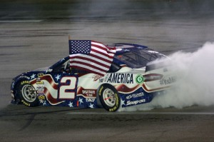 Brad Keselowski celebrates with a burnout after winning Saturday night's NASCAR Sprint Cup Series race at Kentucky Speedway.  Photo by Todd Warshaw/Getty Images