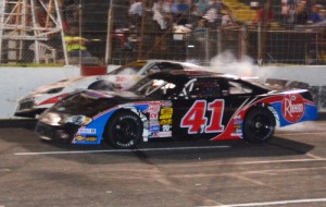 Brayton Haws (41) makes contace with Landon Huffman coming to the checkered flag to score the victory in the Late Model feature Saturday night at Hickory Motor Speedway.  Photo by Sherri Stearns