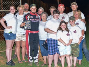 Members of the Rousey family present David McCoy with the fastest qualifier award after winning the pole for the Wendell “Peanut Man” Rousey Memorial race Saturday night at Hartwell Speedway.  McCoy would go on to win the race from the pole.  Photo by Heather Rhoades