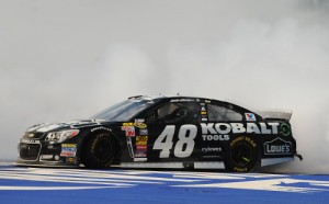 Jimmie Johnson celebrates with a burnout after winning Sunday's NASCAR Sprint Cup Series race at Michigan International Speedway. Photo by Jonathan Moore/NASCAR via Getty Images