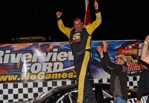 Johnny Clark celebrates in victory lane after scoring his first PASS North Series victory since 2012 Saturday night at Speedway 660.  Photo by Norm Marx