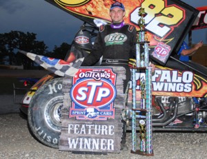 Roger Crockett held on after a tire ble on the final lap to score his first career World of Outlaws STP Sprint Car Series victory at I-94 Speedway.  Photo by Tim Johnson