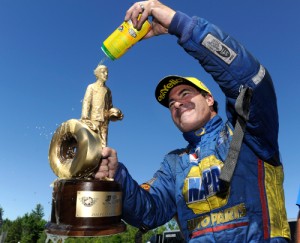 Ron Capps celebrates after scoring his first NHRA Funny Car victory of the season Sunday afternoon at New England Dragway.  Photo courtesy NHRA Media