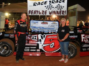 Ronnie Johnson of Chattanooga, TN receives the $2,000 check and the Bill Hendren Memorial 40 Trophy from Bettie Hendren after Johnson was declared the NeSmith Chevrolet Dirt Late Model Series race winner driving Friday night at Tri-County Race Track.  Photo by Piña Pix Photography