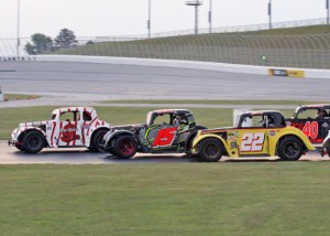 Skip Nichols (9) battles for the lead with Bill Plemons, Jr. (15), Tyler Moseley (22) and Tina Johnson (40) in Thursday night's Legends Masters feature at Atlanta Motor Speedway.  Nichols would go on to score the victory.  Photo by Tom Francisco/Speedpics.net