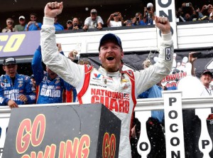 Dale Earnhardt, Jr. celebrates in Victory Lane after winning Sunday's NASCAR Sprint Cup Series race at Pocono Raceway, giving him a clean sweep of both races this year at the Long Pond, PA track.  Photo by Jeff Zelevansky/Getty Images