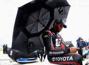 Darrell Wallace, Jr. sits on the grid under an umbrella prior to qualifying for the NASCAR Camping World Truck Series race at Chicagoland Speedway.  Photo by Jeff Zelevansky/NASCAR via Getty Images