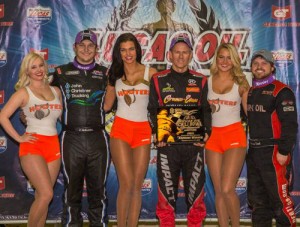 Veteran Jerry Coons, Jr. (center) scored the win in Thursday night's A-Feature, locking himself into his 12th consecutive years Chili Bowl Midget Nationals Saturday main feature. Andrew Deal (right) finished in second, with four time event winner Kevin Swindell (left) in third. Photo by Pat Grant