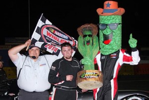 Tayler Riddle celebrates in victory lane after scoring the victory in Saturday night's Chilly Willy 100 at Tuscon Speedway.  Photo by Redhawk Graphics