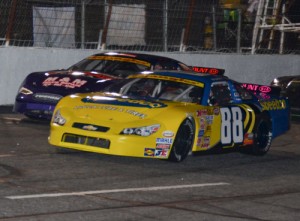 Josh Berry (88) battles with Ashley Huffman (7) en route to the Late Model Stock victory Saturday night at Hickory Motor Speedway.  Photo by Sherri Stearns