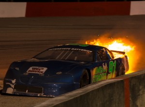 Flames shoot out from under Larry Speakman's Late Model Sportsman mount during Saturday night's feature.  Photo courtesy MMS Media