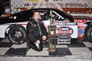 Ronnie McCarty poses in victory lane after winning the second Late Model Stock feature.  Photo courtesy Kingsport Speedway Media