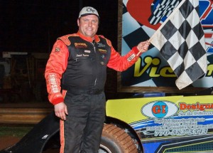 Frank Ingram celebrates in victory lane after scoring the Super Late Model feature at Dixie Speedway in Saturday night's regular season opener.  Photo by Kevin Prater/praterphoto.com