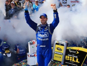 Jimmie Johnson celebrates in victory lane after winning Sunday's NASCAR Sprint Cup Series race at Dover International Speedway.  Photo by Daniel Shirey/NASCAR via Getty Images