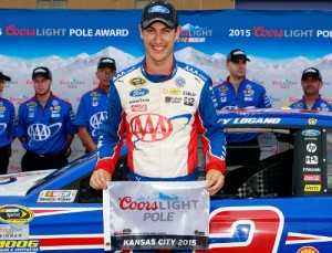 Joey Logano celebrates after winning the pole for Saturday night's NASCAR Sprint Cup Series SpongeBob SquarePants 400 at Kansas Speedway.  Photo by Brian Lawdermilk/NASCAR via Getty Images