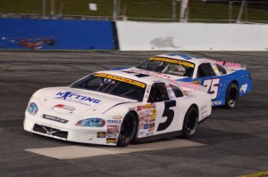 Dexter Canipe, Jr. (5) battles with Landon Huffman (75) en route to the Late Model victory Saturday night at Hickory Motor Speedway.  Photo by Sherri Stearns