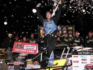 Doug Coby celebrates his second win of the NASCAR Whelen Modified Tour season Wednesday night at Thompson Speedway Motorsports Park.  Photo by Tim Bradbury/Getty Images for NASCAR