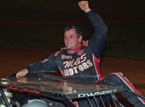 John Ownbey climbs from his car after scoring his second straight NeSmith Chevrolet Dirt Late Model Series victory on Saturday night at 411 Motor Speedway.  Photo courtesy NeSmith Media