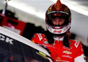 Kevin Harvick climbs into his car in the garage area during practice for Sunday's NASCAR Sprint Cup Series race at Pocono Raceway.  Photo by Jeff Zelevansky/NASCAR via Getty Images