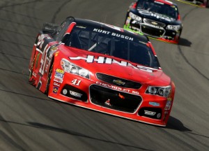 Kurt Busch leads a pack of cars during Sunday's NASCAR Sprint Cup Series race at Michigan International Speedway. Photo by Rey Del Rio/Getty Images