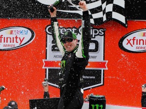 Kyle Busch celebrates in victory lane after winning Saturday's NASCAR Xfinity Series race at Michigan International Speedway.  Photo by Brian Lawdermilk/Getty Images