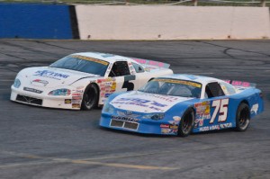 Landon Huffman (75) battles with Dexter Canipe, Jr. (5) en route to the Late Model Stock victory at Hickory Motor Speedway on Saturday night.  Photo by Sherri Stearns