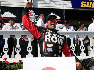 Martin Truex, Jr. celebrates after winning last year's NASCAR Sprint Cup Series race at Pocono Raceway.  Photo by Chris Trotman/Getty Images