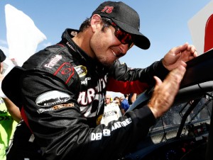 Martin Truex, Jr. affixes the winners decal to his car in victory lane after winning last week's NASCAR Sprint Cup Series race at Pocono Raceway.  Photo by Jeff Zelevansky/NASCAR via Getty Images