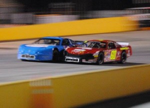 R.A. Brown (60) battles with Kenneth Headen (99) en route to the victory in Friday night's Late Model Stock feature at Anderson Motor Speedway.  Photo by Christy Kelley