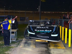 Race officials indicate that Scott Bloomquist failed to make weight after being flagged as the winner of the race.  Photo by Rick Schwallie