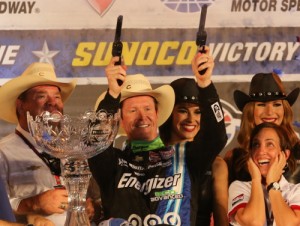 Scott Dixon fires off the six-shooters in victory lane following his win in Saturday night's Verizon IndyCar Series race at Texas Motor Speedway.  Photo by Chris Jones