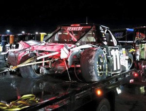 Ben Kennedy's destroyed Toyota is taken back to the garage area after a massive crash at Kentucky Speedway that left a portion of the heavily damaged, cutting the race short.  Kennedy was uninjured in the crash.  Photo by Matt Weaver