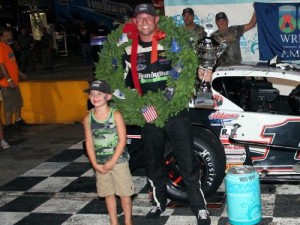 Burt Myers celebrates in victory lane after winning Friday night's KOMA Modified victory at Anderson Motor Speedway.  Photo by SunSet Graphics