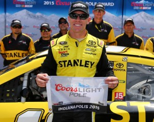 Carl Edwards poses with the Coors Light Pole Award after qualifying for the pole position for Sunday's NASCAR Sprint Cup Series race at Indianapolis Motor Speedway.  Photo by Sarah Crabill/NASCAR via Getty Images