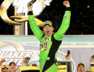 Kyle Busch celebrates in victory lane after winning Saturday night's NASCAR Sprint Cup Series race at Kentucky Speedway.  Photo by Daniel Shirey/Getty Images