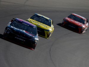 Denny Hamlin (11), Matt Kenseth (20) and Carl Edwards (19) turn laps during practice for the NASCAR Sprint Cup Series race at Michigan International Speedway.  Photo by Brian Lawdermilk/NASCAR via Getty Images